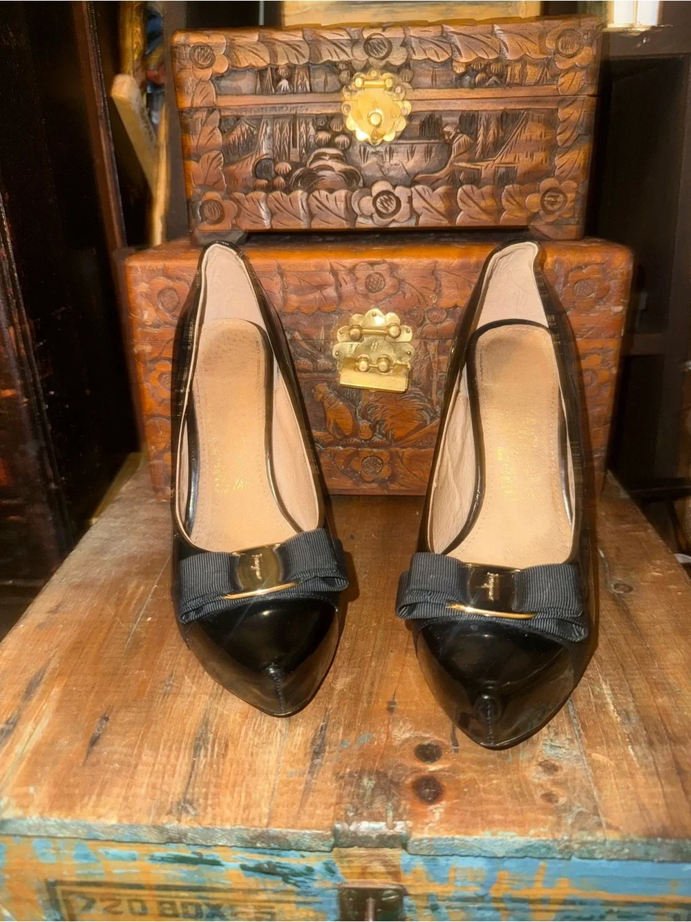 Salvatore Ferragamo Black Patent featuring iconic gold plate & grosgrain bow